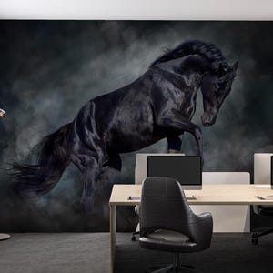 May include: A black horse rearing up against a dark, smoky background, depicted on a wall mural. The image is in an office setting with desks, chairs, and computer monitors. The room has large windows and a modern design.