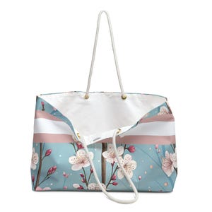 Large cherry blossom personalized weekender tote bag with rope handles on a clean background, ideal for travel, beach days, or mahjong accessories.