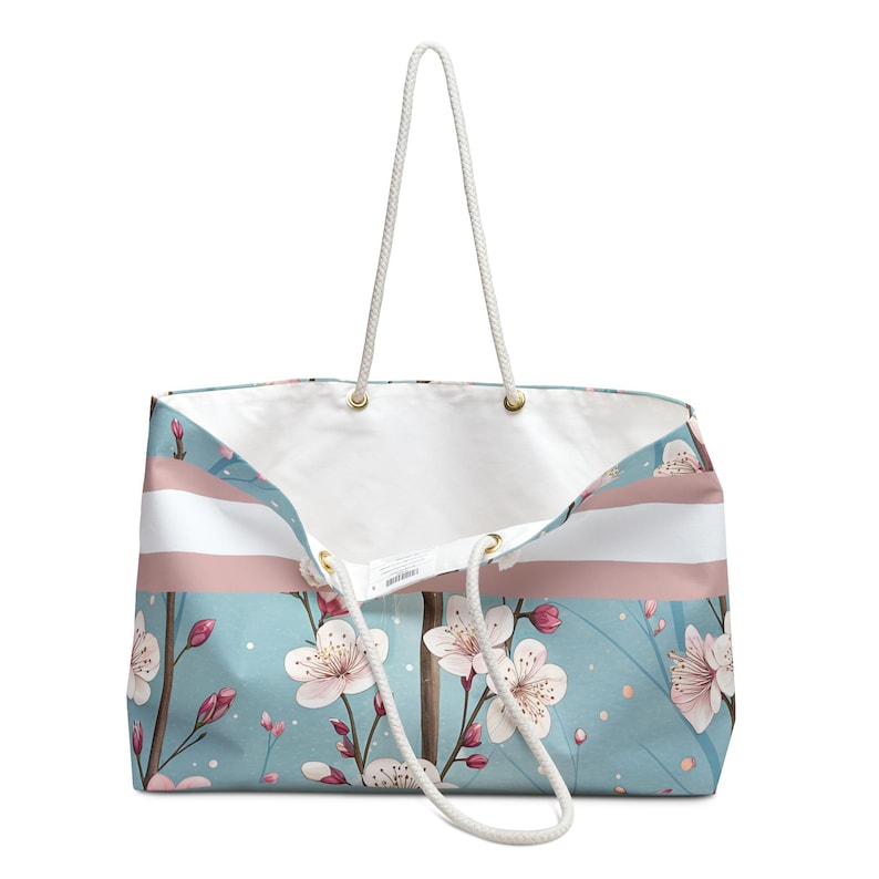 Large cherry blossom personalized weekender tote bag with rope handles on a clean background, ideal for travel, beach days, or mahjong accessories.