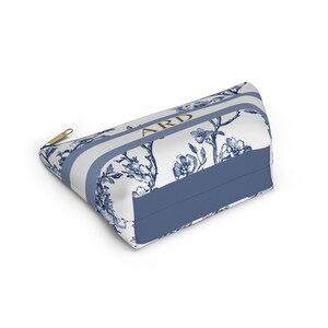 Angled view of the personalized toile cosmetic bag showing the structured bottom and side panels.