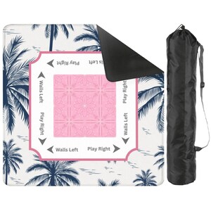 Palm Beach style Mahjong mat with pink center and navy palm print, shown with non-slip backing and black drawstring carrying bag for storage and travel.
