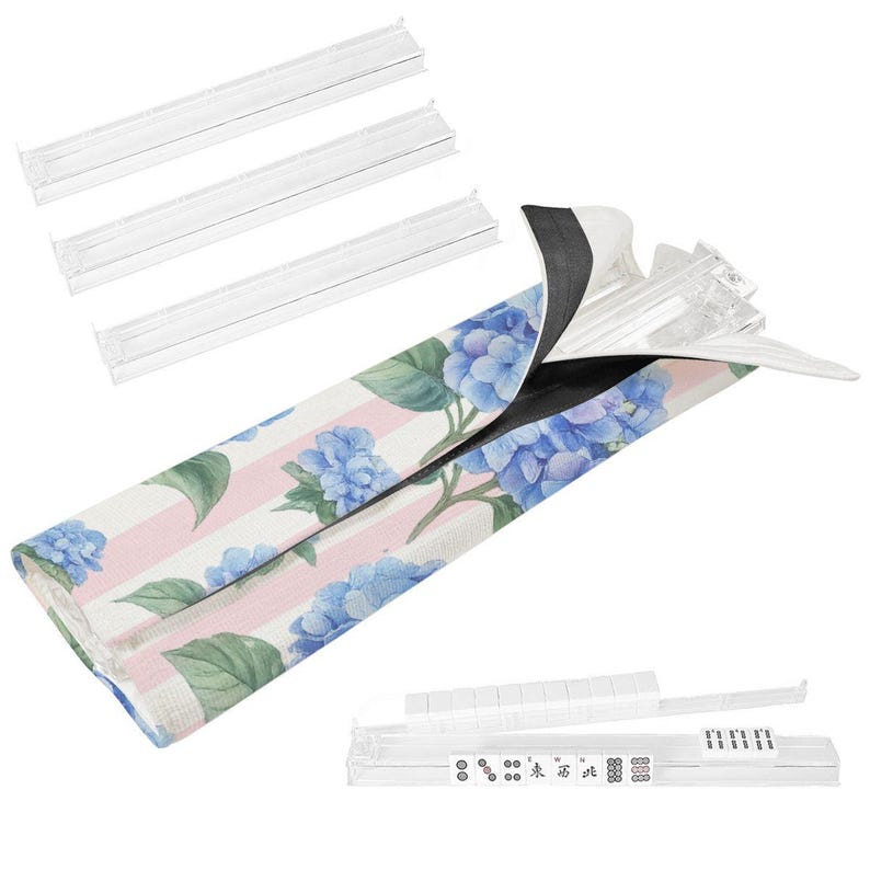 Floral hydrangea Mahjong tile bag with pink stripes and clear tile rack displayed on a Mahjong table with white mat and tiles arranged around the table.