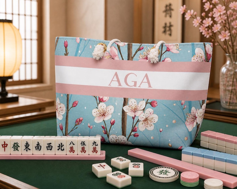 Cherry blossom personalized tote bag used as a mahjong accessory bag on a mahjong table with tiles and racks, showing large storage capacity.