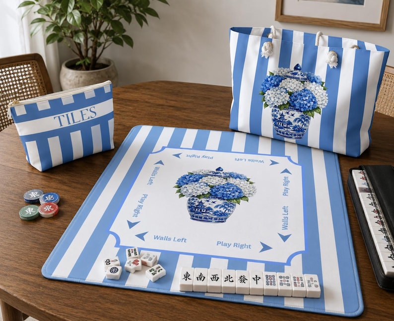 Coastal Mahjong bundle mockup featuring blue striped hydrangea Mahjong mat, matching tile bag, and accessory tote styled together on a wooden game table.