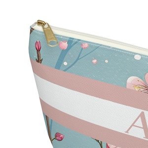 Floral personalized accessory pouch with monogram detail, compact size perfect for makeup, travel essentials, or small mahjong pieces.