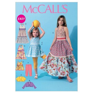 May include: McCall's Easy sewing pattern for girls' dresses. The pattern includes a variety of styles, including a sleeveless dress with a tiered skirt, a dress with a halter neckline, and a dress with a ruffled skirt. The pattern also includes instructions for making a cardigan and leggings.