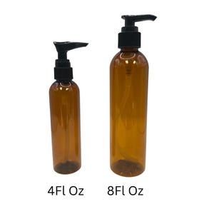 May include: Two amber-colored plastic bottles with black pump dispensers. The smaller bottle is labeled "4Fl Oz" and the larger bottle is labeled "8Fl Oz". Both bottles are cylindrical and sit against a white background.