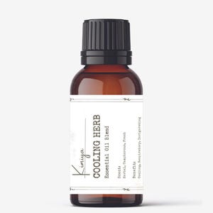 May include: A brown glass bottle with a black cap, labeled "Kimiya COOLING HERB Essential Oil Blend". The label also includes the scent and benefits of the oil blend: "Scent: Herbal, Camphorous, Fresh" and "Benefit: Cooling, Respiratory, Invigorating".
