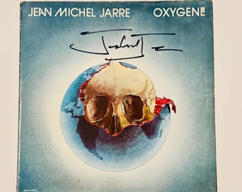 Portada de vinilo de Jean-Michel Jarre autografiada con certificado de autenticidad.