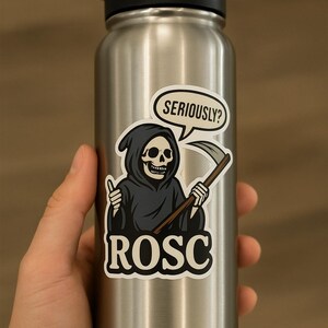 May include: A stainless steel water bottle with a black lid. A sticker on the bottle features a cartoon grim reaper with a scythe and the text "SERIOUSLY?" in a speech bubble. The word "ROSC" is below the grim reaper.