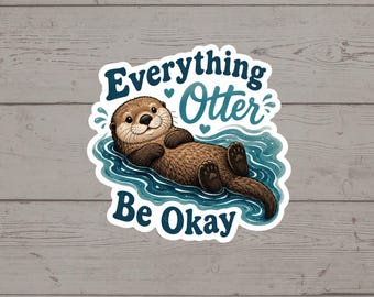 Puede incluir: Una pegatina troquelada que muestra una nutria marrón flotando de espaldas en agua azul. El texto Everything Otter Be Okay está escrito en letra cursiva y de imprenta azul oscuro sobre y debajo de la nutria, con dos pequeños corazones azul claro.