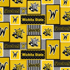 May include: A yellow and black fabric with a repeating pattern of the Wichita State University logo, the letters "W" and "Shockers", and the words "Wichita State".