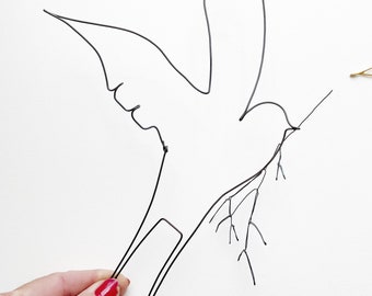 Swallow in wire, and its branch, wall decoration in wire, handmade in France, swallow in annealed wire.