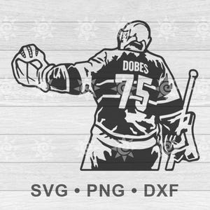 Op de afbeelding: Zwart-wit afbeelding van een hockeydoelman in een trui met de naam "DOBES" en het nummer "75" op de rug. De doelman staat klaar, met een hockeystick en handschoen. De afbeelding bevat de tekst "SVG • PNG • DXF".