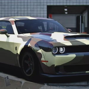 May include: A camouflage-patterned sports car with a black hood scoop and black wheels. The car has a sleek, modern design with rounded headlights and a low profile. The camouflage design incorporates shades of green, brown, and tan.