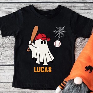 Cute Ghost Playing Baseball Custom Name Shirt,Custom Boys Halloween Tee,Baseball Fall Shirt,Spooky Baseball Tee,Baseball Fan Shirt Boys Kids