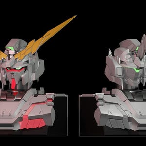 May include: A white and gray robot bust with a gold and yellow antenna. The robot has red glowing lights on the chest and green glowing lights on the face.