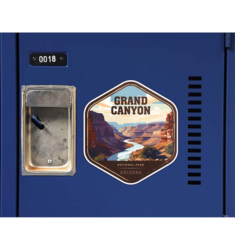May include: A hexagonal sticker featuring a graphic illustration of the Grand Canyon with a winding river, layered rock formations, and the text GRAND CANYON NATIONAL PARK ARIZONA, applied to a blue metal locker door with the number 0018.