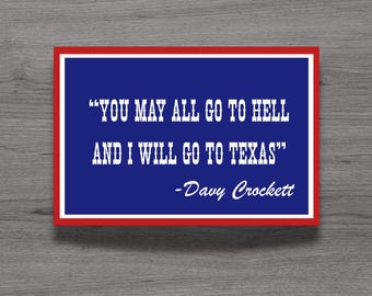 May include: A rectangular sign with a deep blue background and a bold red border. The white text reads, "YOU MAY ALL GO TO HELL AND I WILL GO TO TEXAS" followed by the attribution "-Davy Crockett" in a white script font centered below the quote.