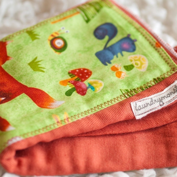 Forest creatures on rust orange hand dyed burp cloth