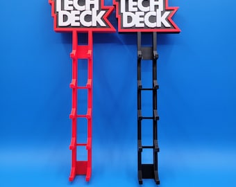 May include: Two Tech Deck fingerboard display stands, one red and one black. Each stand has a sign with the words "Tech Deck" in white letters. The stands are designed to hold multiple fingerboards.
