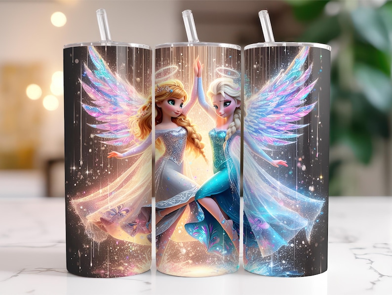 May include: Three stainless steel tumblers with straws, each featuring a fantasy illustration of two angelic figures with wings. The figures are dressed in flowing gowns, with a sparkling background and a celestial theme.