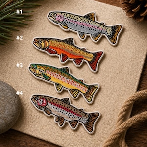 May include: Four embroidered fish patches in vibrant colors, including rainbow trout, on a tan fabric background. Each patch is numbered and features detailed stitching, showcasing the fish's scales and fins. A rustic theme with natural elements.