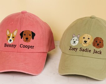 May include: Two baseball caps with embroidered dog faces. One is a dusty rose color with the names "Benny" and "Cooper" below the dog faces. The other is olive green with the names "Zoey", "Sadie", and "Jack" below the dog faces.