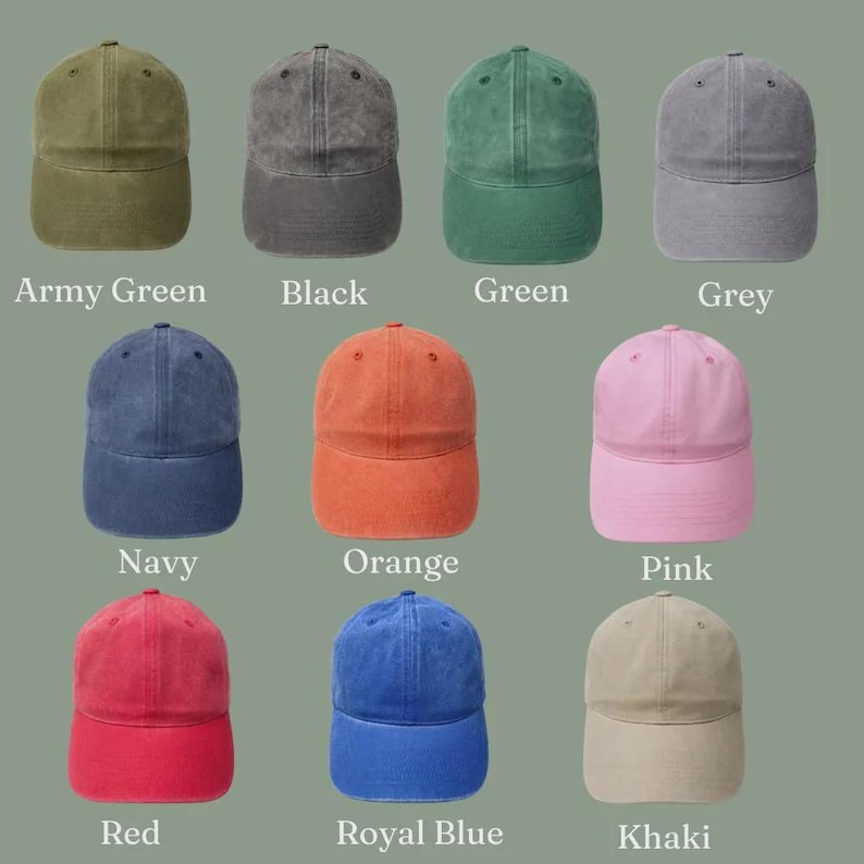 May include: A collection of ten baseball caps in various colors, including army green, black, green, grey, navy, orange, pink, red, royal blue, and khaki. Each cap has a curved brim and a fabric strap.
