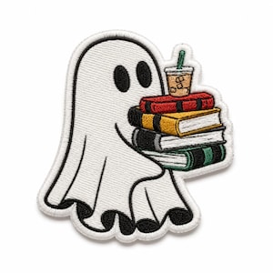 May include: An embroidered patch featuring a white ghost with black eyes holding a stack of four books in red, yellow, white, and green, topped with a small plastic cup containing an iced coffee drink with a green straw and brown liquid.