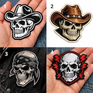 May include: Four embroidered patches featuring skull designs. One skull wears a cowboy hat, another a bandana, and a third a fedora. The fourth skull is surrounded by red lightning bolts. All are black and white with detailed stitching.