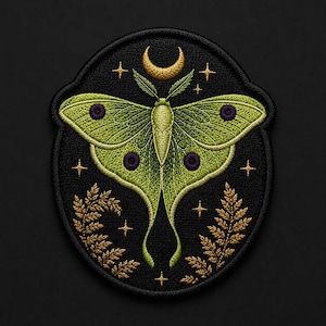 May include: Embroidered patch featuring a green moth with purple spots and a gold crescent moon. The moth is set against a black background with gold stars and foliage. The patch has a detailed, textured appearance.