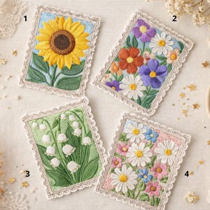 May include: Four embroidered floral patches. One features a sunflower, another a mix of flowers, a third showcases lily of the valley, and the last displays daisies. Each patch has a scalloped border and a light blue, green, or pink background.