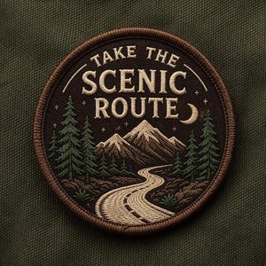 May include: Embroidered patch with the text "TAKE THE SCENIC ROUTE" in cream-colored letters. The patch features a mountain landscape with a winding road, trees, a crescent moon, and stars, all in shades of brown and green.