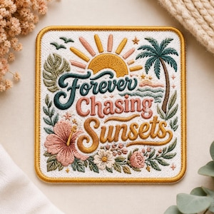 May include: Embroidered patch with a square shape and a gold border. The design features a sunset, palm tree, flowers, and the text "Forever Chasing Sunsets" in a vintage style. The colour palette includes shades of orange, pink, green, and blue.
