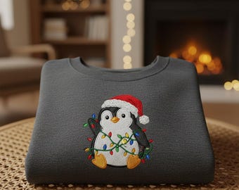 Custom Christmas Penguin Embroidery Sweatshirt with Santa Hat and Lights, Cute Holiday Crewneck, Cozy Mini Embroidered Winter Gift