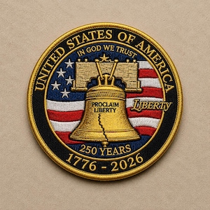 May include: A circular embroidered patch featuring the Liberty Bell in gold thread over a red, white, and blue American flag background. Text includes UNITED STATES OF AMERICA, IN GOD WE TRUST, PROCLAIM LIBERTY, LIBERTY, 250 YEARS, and 1776-2026.