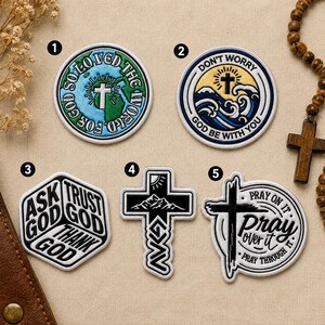 May include: Five circular, hexagonal, and cross-shaped embroidered patches featuring religious themes. Patch 1 shows a globe with a cross and text. Patch 2 depicts waves and a cross. Patch 3 is a hexagon with text. Patch 4 is a cross with mountains. Patch 5 features a cross and text.
