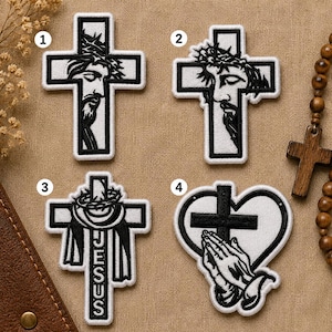 May include: Four white embroidered patches with black outlines. Patch 1 and 2 show a face with a crown of thorns on a cross. Patch 3 shows a cross with a crown of thorns and the word JESUS. Patch 4 shows praying hands inside a heart with a cross.