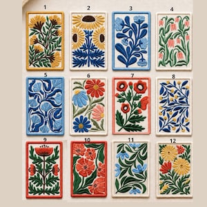 May include: Twelve embroidered floral patches, each with a different design of colourful flowers and foliage. The rectangular patches have contrasting borders and feature a variety of colours, including yellow, blue, red, and green. Each patch is unique.
