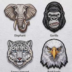 May include: Four embroidered animal patches: an elephant, a gorilla, a snow leopard, and a bald eagle. Each patch features detailed stitching and realistic depictions of the animals' faces. The text "Elephant", "Gorilla", "Snow Leopard", and "Bald Eagle" are below each patch.