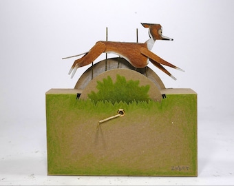 ZUBER - Running Whippet Automaton - Turn the handle to make the dog run over sunny fields. Based on Zuber the whippet from 1890.