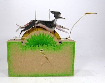 ASHLEY - Running Whippet Automaton - Turn the handle to make the dog run & chase the frisbee. Based on the famous first 'disk dog' from 1974