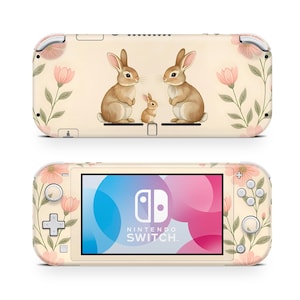 May include: A cream-colored Nintendo Switch Lite console skin featuring a family of three rabbits and pink floral accents. The design includes a large screen with the Nintendo Switch logo and colorful graphics.