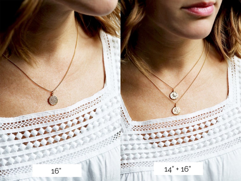 May include: Two gold necklaces with coin pendants. The necklace on the left is 16 inches long and the necklace on the right is 14 inches long with a 16 inch extender.