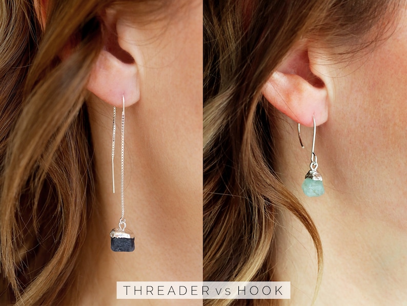 May include: Two pairs of earrings with different styles: a silver threaded earring with a black stone and a silver hook earring with a light blue stone. The text "THREADER vs HOOK" is below the earrings.