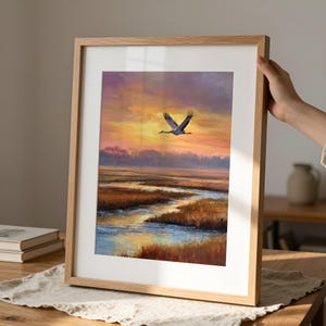 Flying Crane poster for entryway — serene, painterly landscape adorned with warm hues and tranquil coastal reflections at sunset.