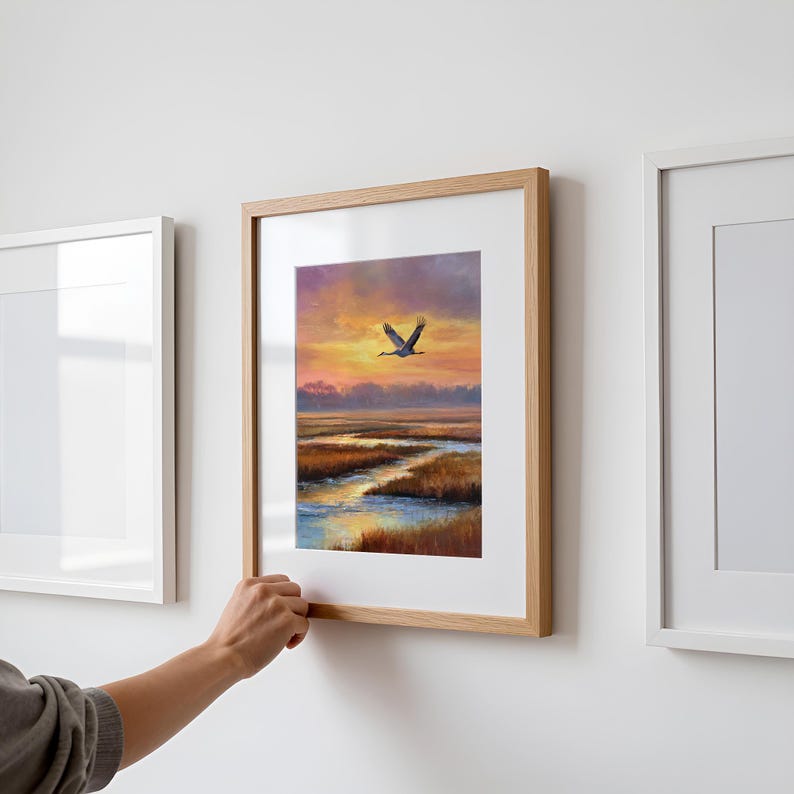 Sandhill Crane artwork for living room — serene flying bird against a painterly sunset with gentle coastal colors and peaceful atmosphere.