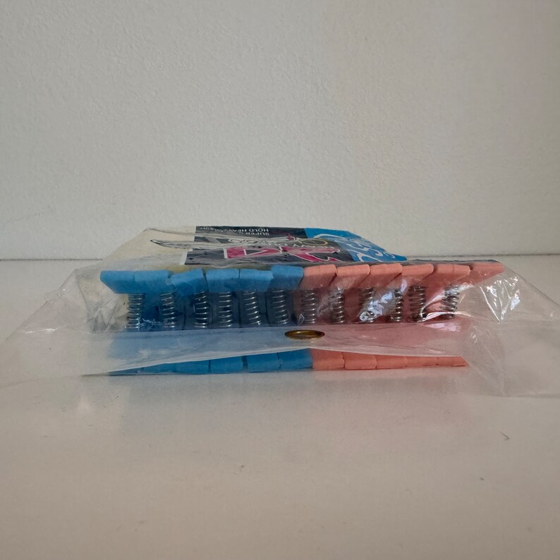 VINTAGE 1980s nos package of 24 plastic CLOTHES PINS pink blue mint