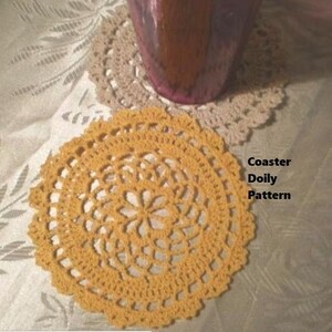 May include: A yellow crocheted doily or coaster with a delicate floral pattern. The text "Coaster Doily Pattern" is visible in the image.